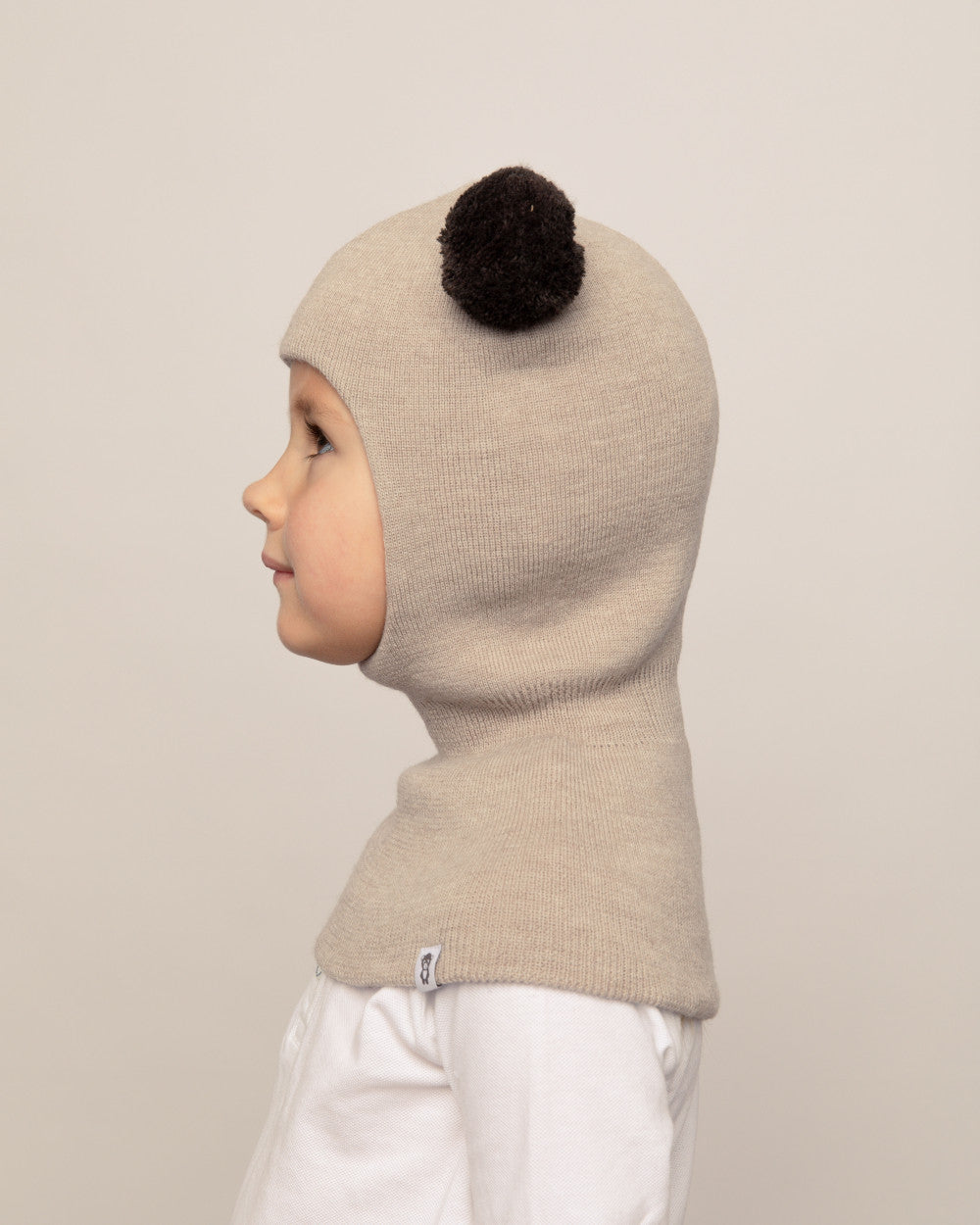 Balaklava i merinoull med tofsar, beige